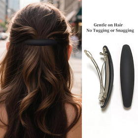 Markuii holding a full ponytail to show strong grip for medium to thick hair