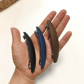 Markuii worn by woman outdoors demonstrating secure hold during active movement