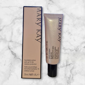 Mary Kay primer texture applied on hand close-up demonstrating lightweight spreadability