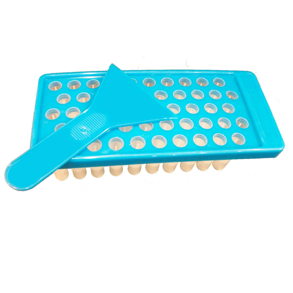 Mary Tylor Naturals tray in use with spatula pouring balm demonstrating easy batch filling