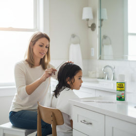 Mata Piojos shampoo applied to hair, demonstrating easy at-home treatment and clear instructions