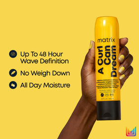 MATRIX creamy conditioner in hand for easy distribution and definition