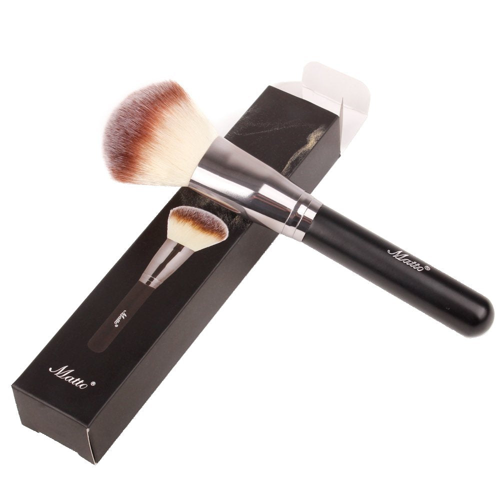 Matto brush on vanity with powders showing practical everyday styling and storage