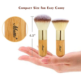 Matto brushes held in hand to show scale and comfortable handle length