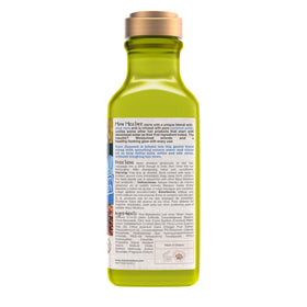 Maui Moisture bottle beside flaxseed and coconut for natural ingredients