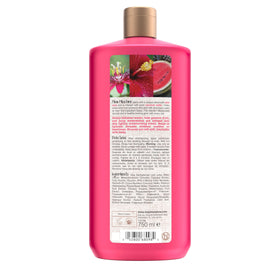 maui moisture bottle styled on tropical bathroom shelf evoking fragrance