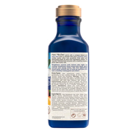 Maui Moisture 13 fl oz bottle in hand to show true size
