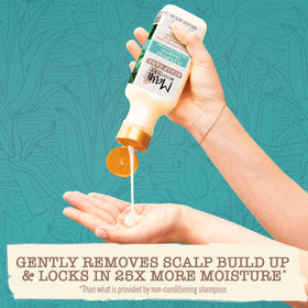 Maui Moisture bottle in hand showing 13 fl oz scale and portability