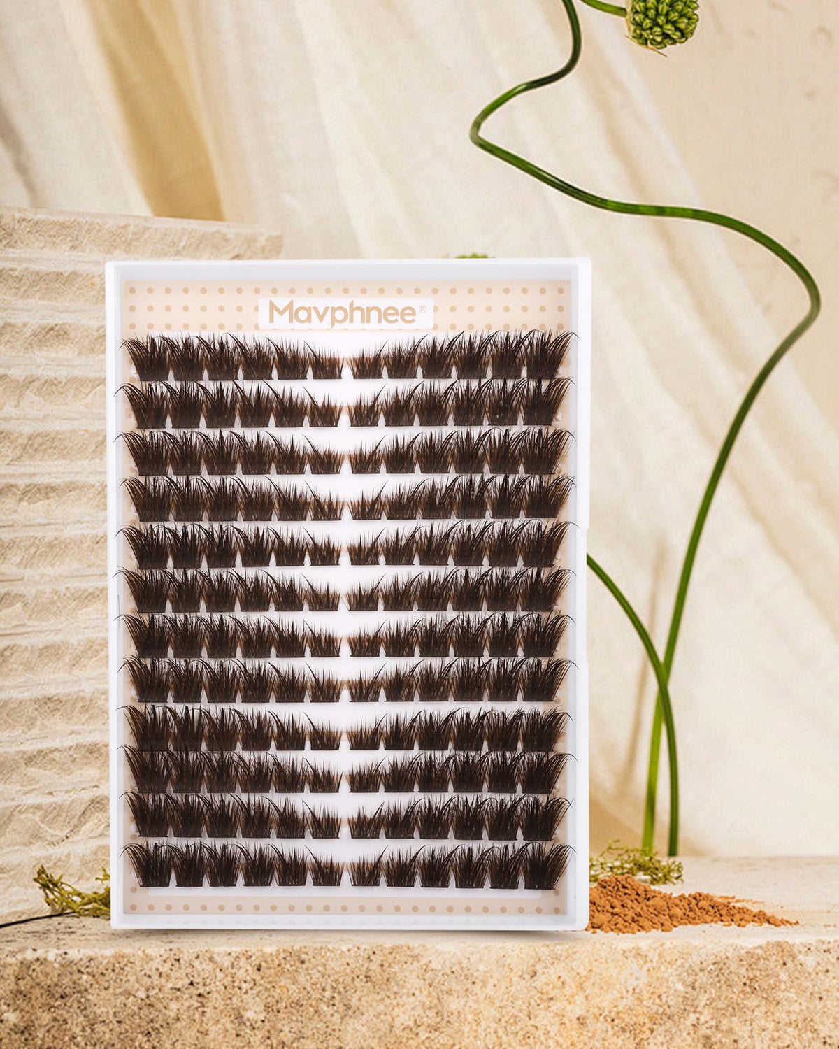 Mavphnee hand holding lashes demonstrating scale and length range