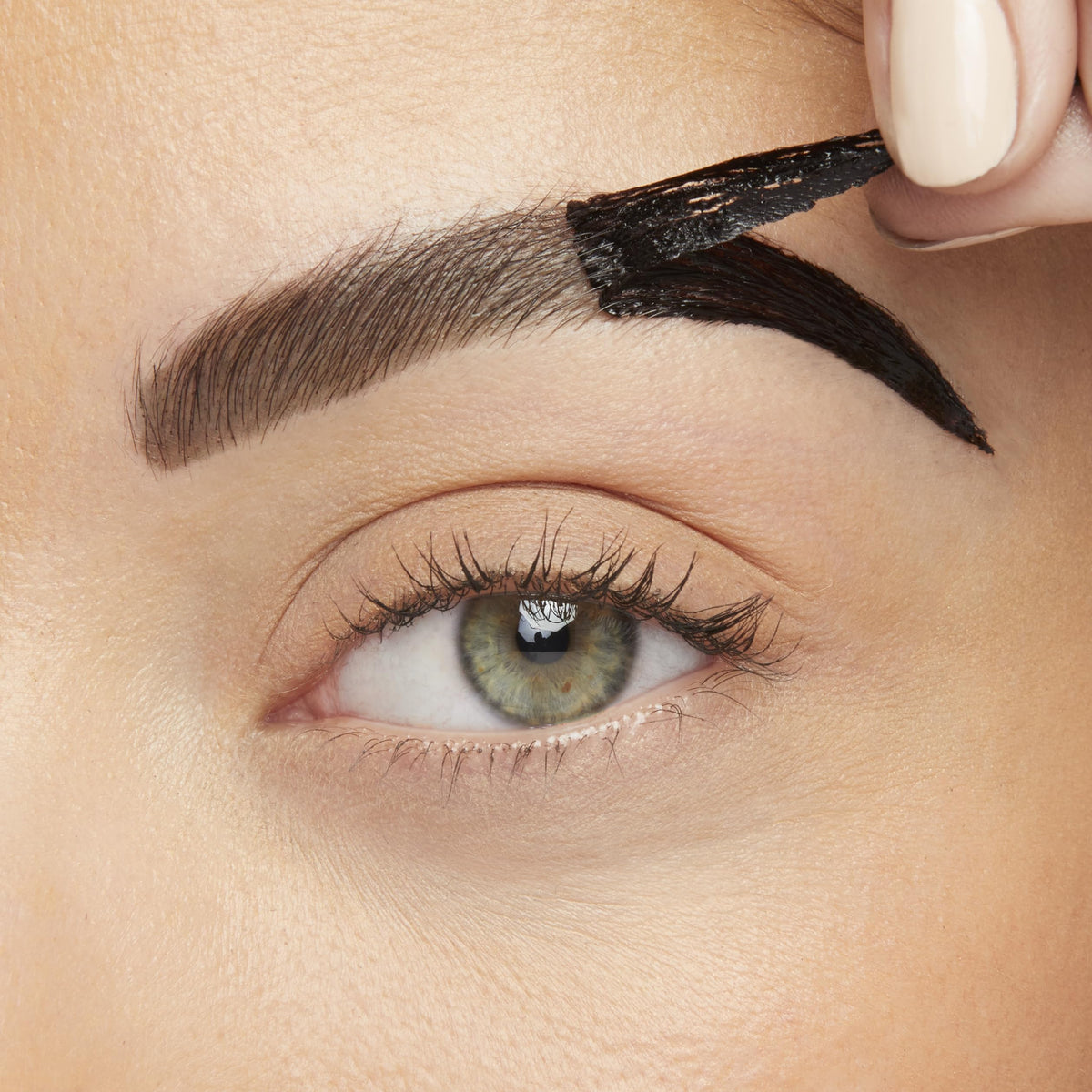 Maybelline Brow Tattoo peel-off film being removed revealing defined brow pigment