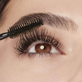 Maybelline Colossal being applied to lashes to create instant volume
