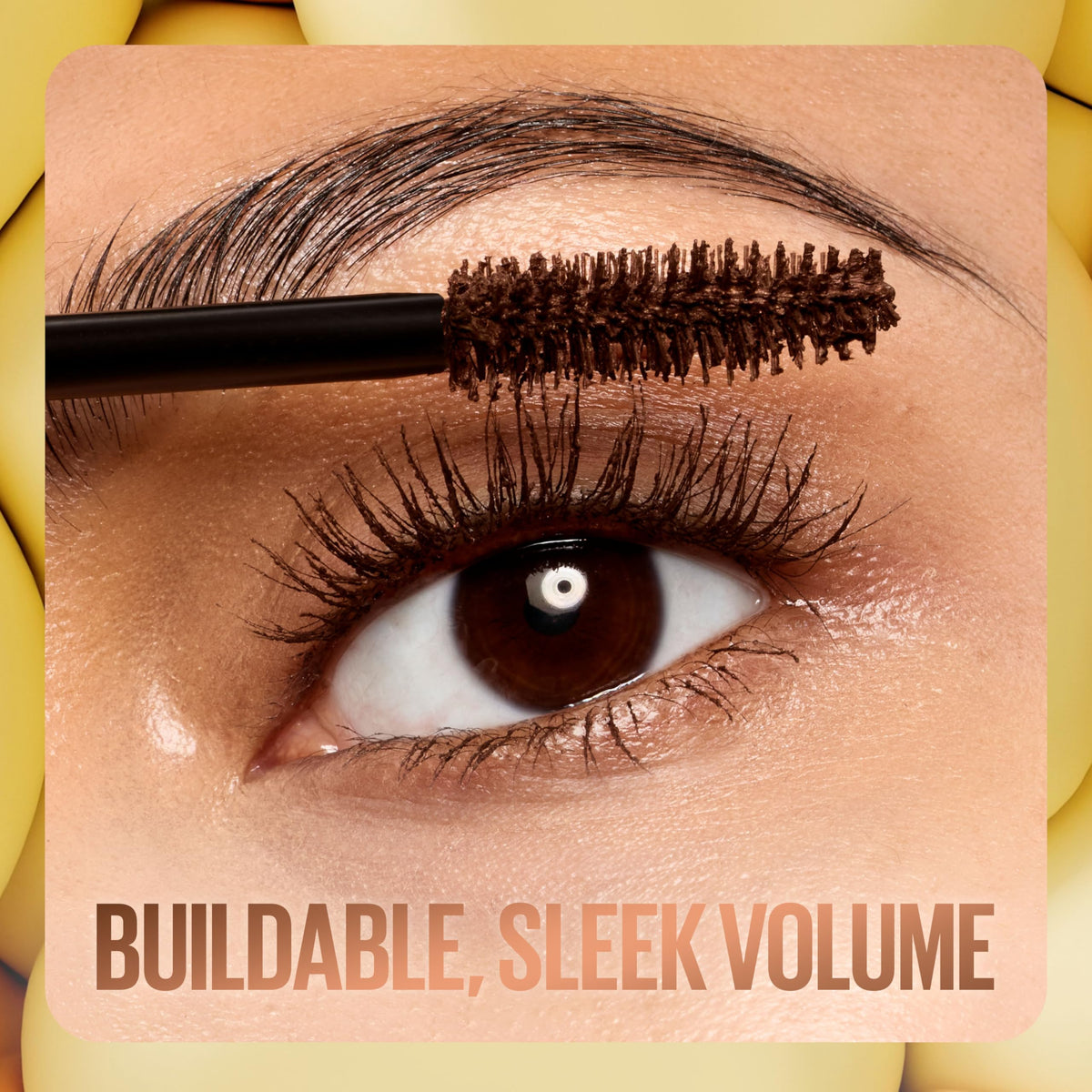 Maybelline Colossal Bubble tube next to hand to show compact travel-friendly size