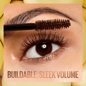 Maybelline Colossal Bubble tube next to hand to show compact travel-friendly size
