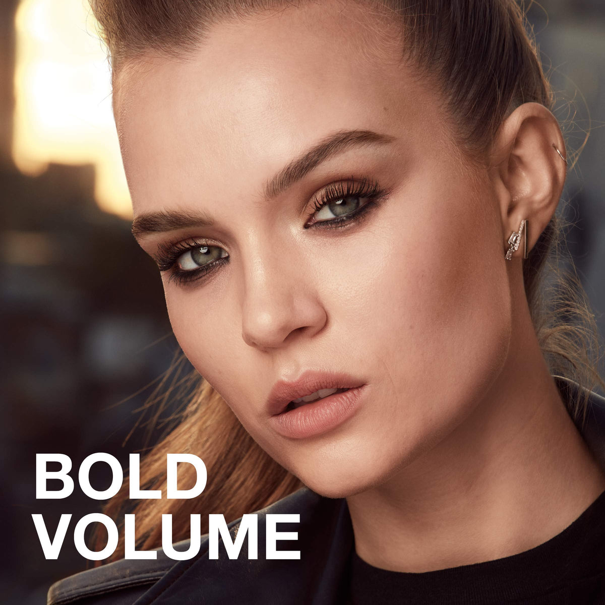 Maybelline mascara held in hand to show compact size and portability