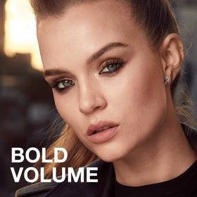 Maybelline mascara held in hand to show compact size and portability