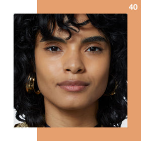 Maybelline Fit Me concealer applied under eye demonstrating brightening benefit