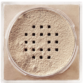 Maybelline Fit Me loose powder in a makeup bag lifestyle shot for on-the-go touchups