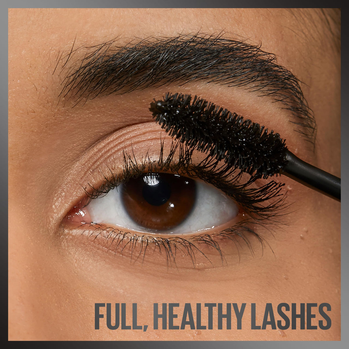 Maybelline applying mascara on lashes for fuller, defined look