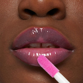 MAYBELLINE lifestyle flatlay with gloss and makeup showing everyday use