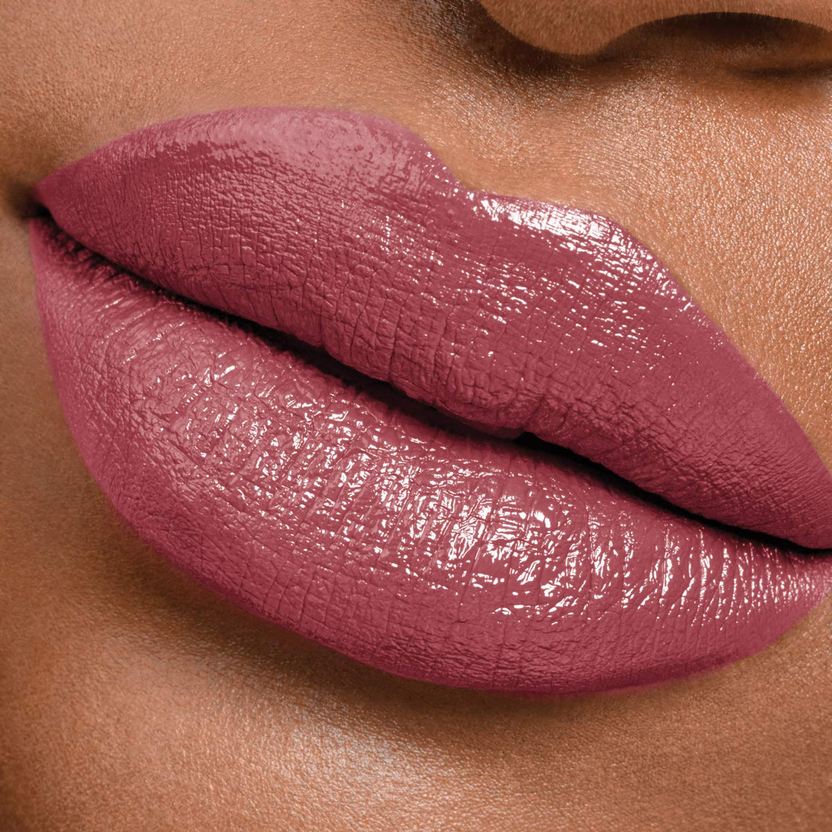 MAYBELLINE Perpetual Plum in a purse lifestyle shot for on‑the‑go use