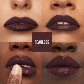 Maybelline swiped on lips showing Fearless brown vinyl shine and all-day color payoff
