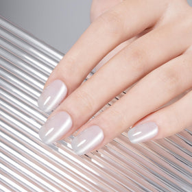 MAYCHAO magnet held over wet polish creating cat-eye stripe for dramatic effect