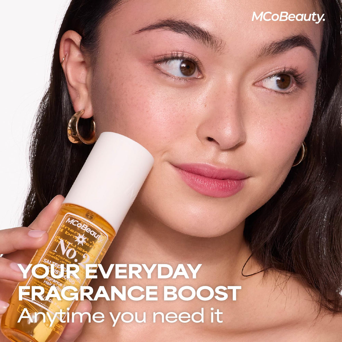 Applying MCoBeauty No.2 to pulse points for long-lasting fragrance boost