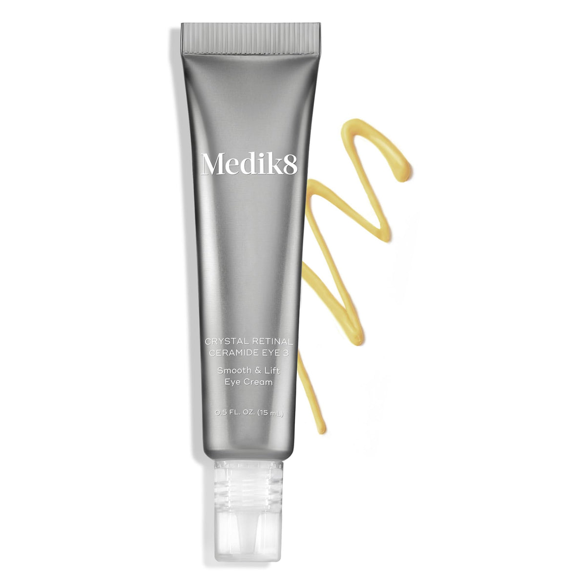 Medik8 eye cream next to coin size comparison highlights compact travel size