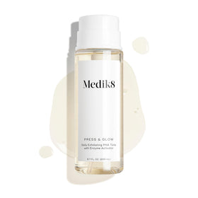 Medik8 on a bathroom shelf staged with towels conveying daily skincare routine benefits