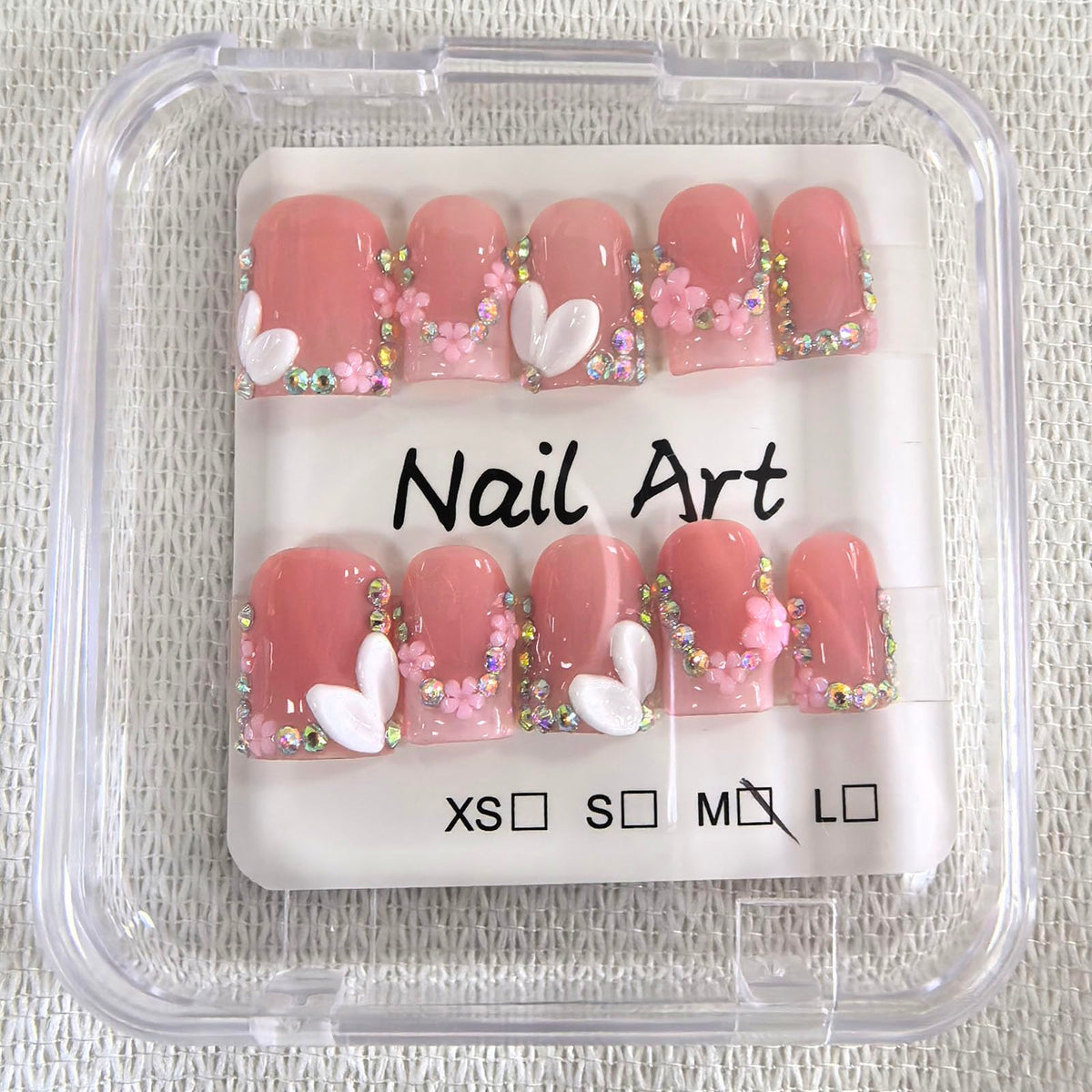 meemooron close-up of 3D flower and rhinestones highlighting decorative detail
