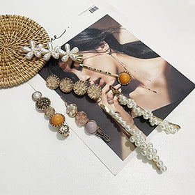 Mehayi flat lay of all 20 pieces illustrating mix of pearls, resin and pins