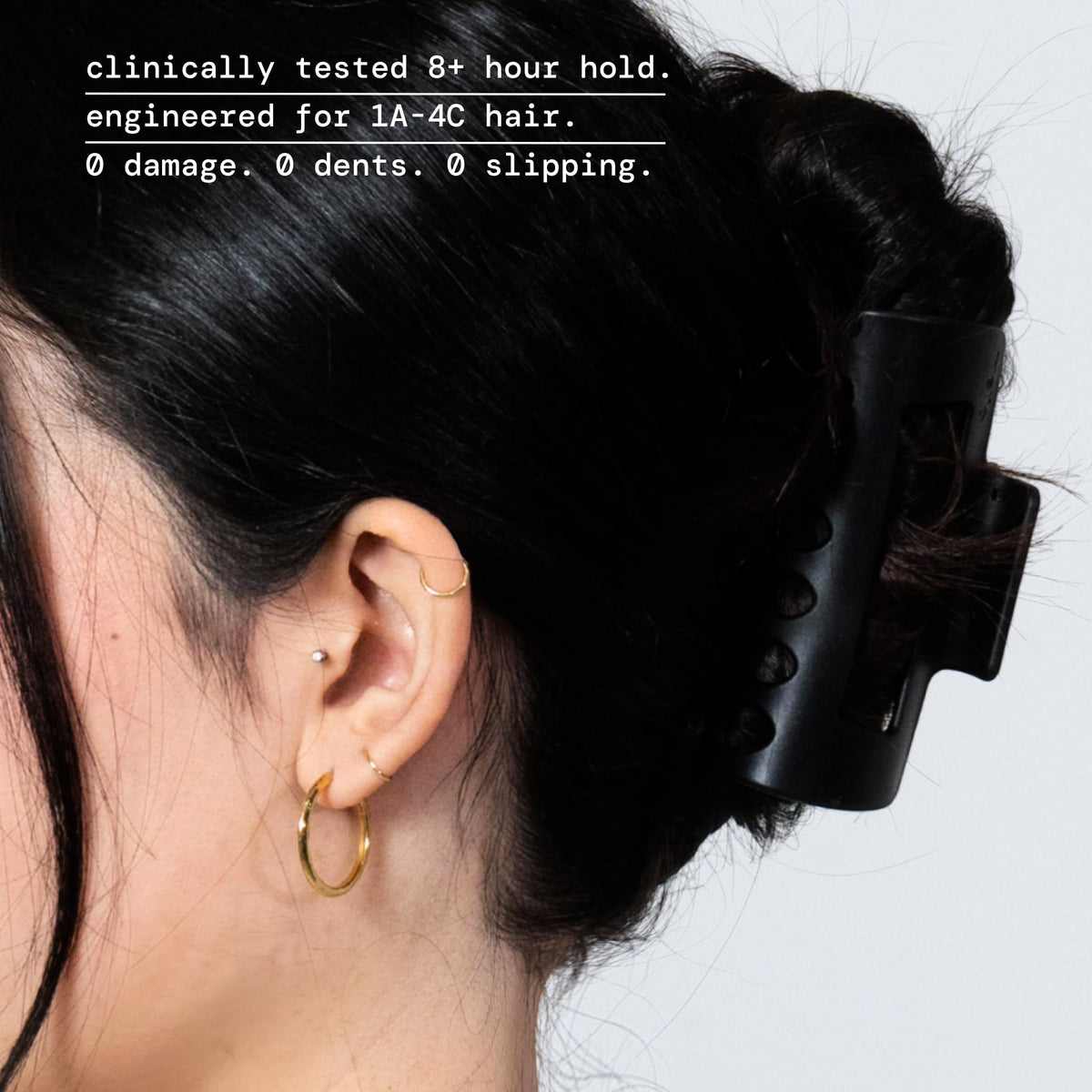 MELLO clip close-up of inward-curving teeth for reduced scalp pressure