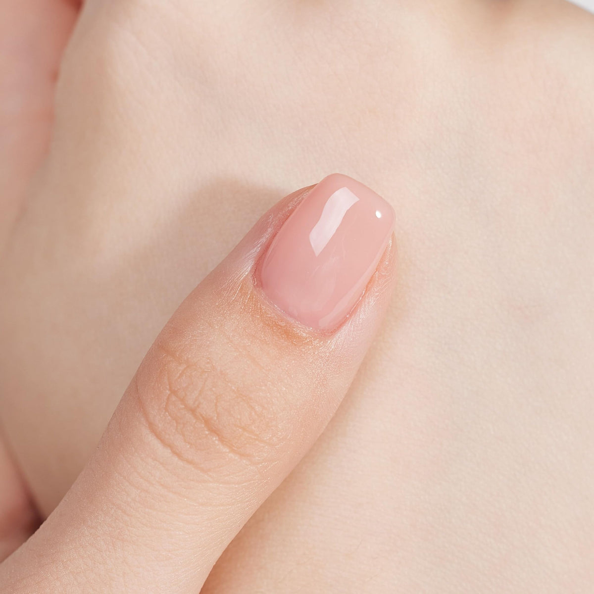 MEMEDA bottle beside LED lamp illustrating required curing for durable gel manicure