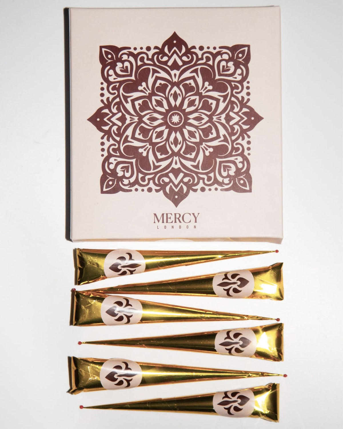 MERCY LONDON cones beside a hand to show size and convenient single-use portioning
