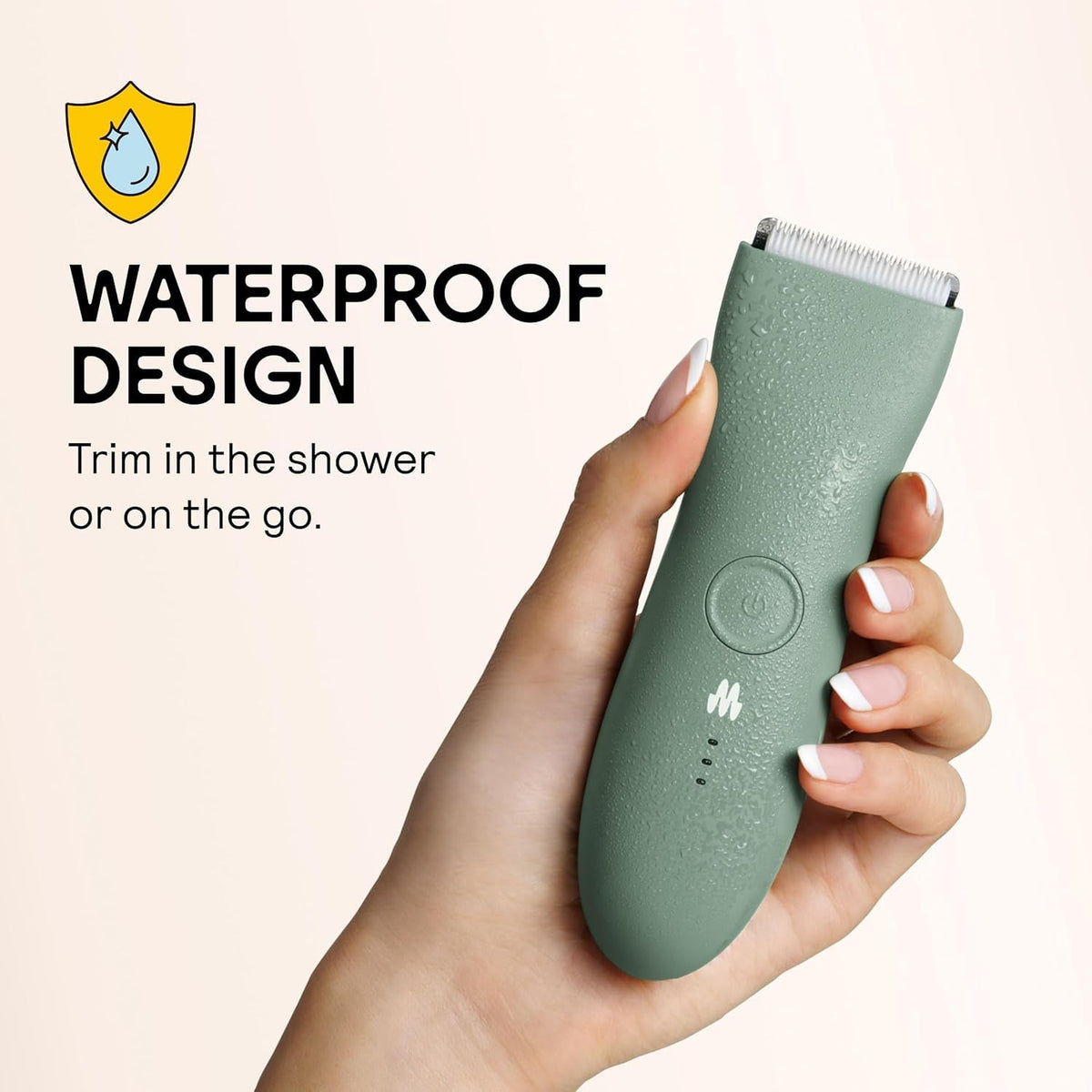MERIDIAN trimmer held in hand to show scale and portable grooming benefit