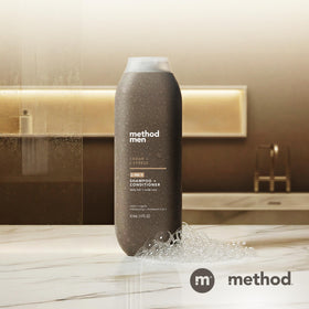 Method Men bottle in outdoor setting evoking cedar cypress scent benefit