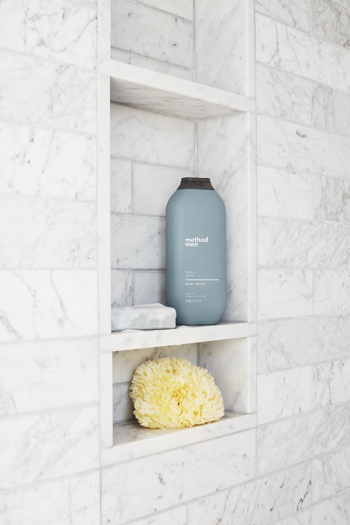 Method bottle beside a razor showing 18 fl oz size and lasting value