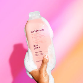 Method bottle held in hand showing 18 oz scale for value and size benefit