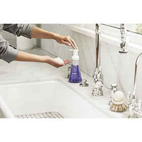Method bottle held in hand showing 10 fl oz scale and convenient size