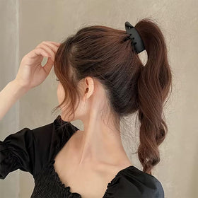 MEZYKAP holding a half-up twist neatly while preventing flyaways during wear