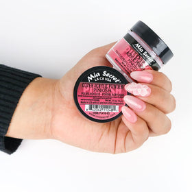 Mia Secret fine pinkish acrylic powder texture close-up showing ease of smoothing