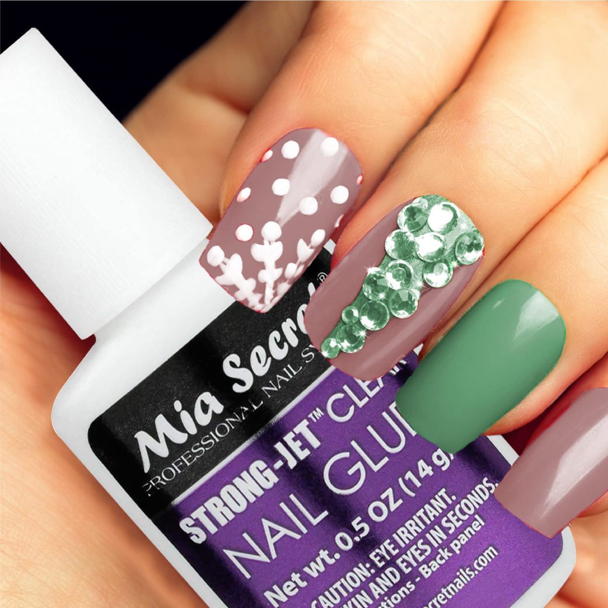 Mia Secret bottle shown next to ruler to show compact size