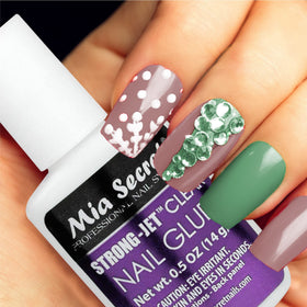 Mia Secret bottle shown next to ruler to show compact size