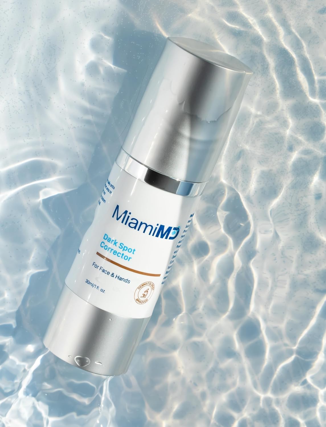 MiamiMD applying serum to hand demonstrating targeted dark spot treatment