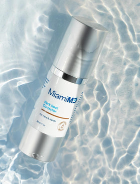 MiamiMD applying serum to hand demonstrating targeted dark spot treatment