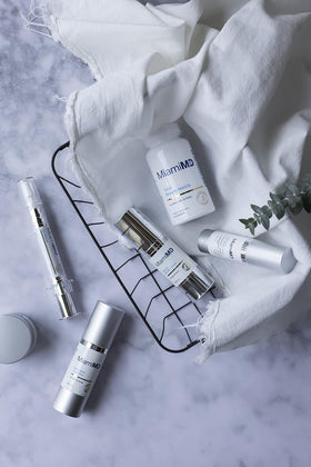 MiamiMD bottle on bathroom vanity suggesting daily skincare routine
