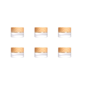 Miayon front view of six small glass jars showing compact travel packing benefit