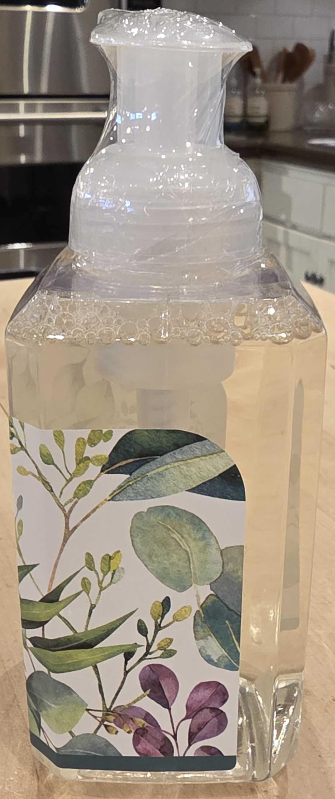 Michel Design Works bottle next to everyday items showing scale and gifting convenience