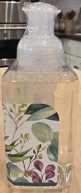 Michel Design Works bottle next to everyday items showing scale and gifting convenience