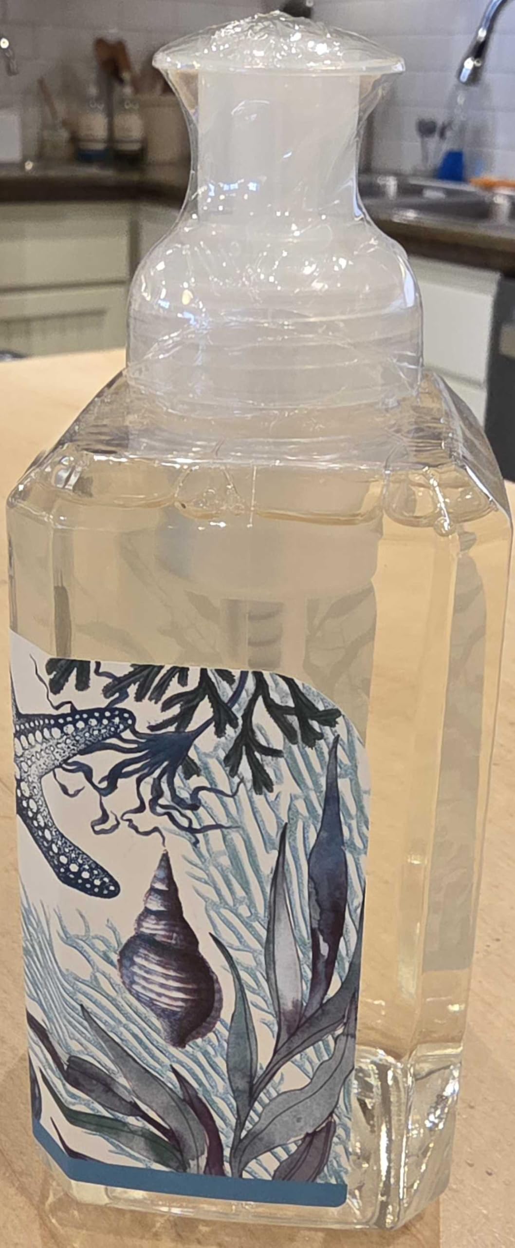 Michel Design Works bottle on bathroom counter evoking coastal freshness benefit